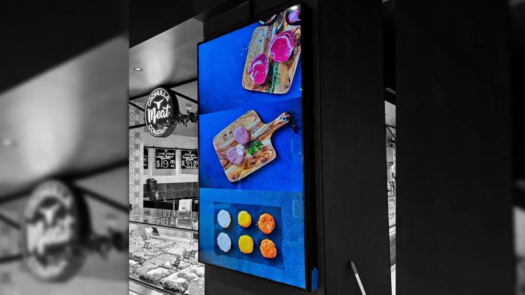 Indoor LED video wall mounted in corporate lobby displaying branded content