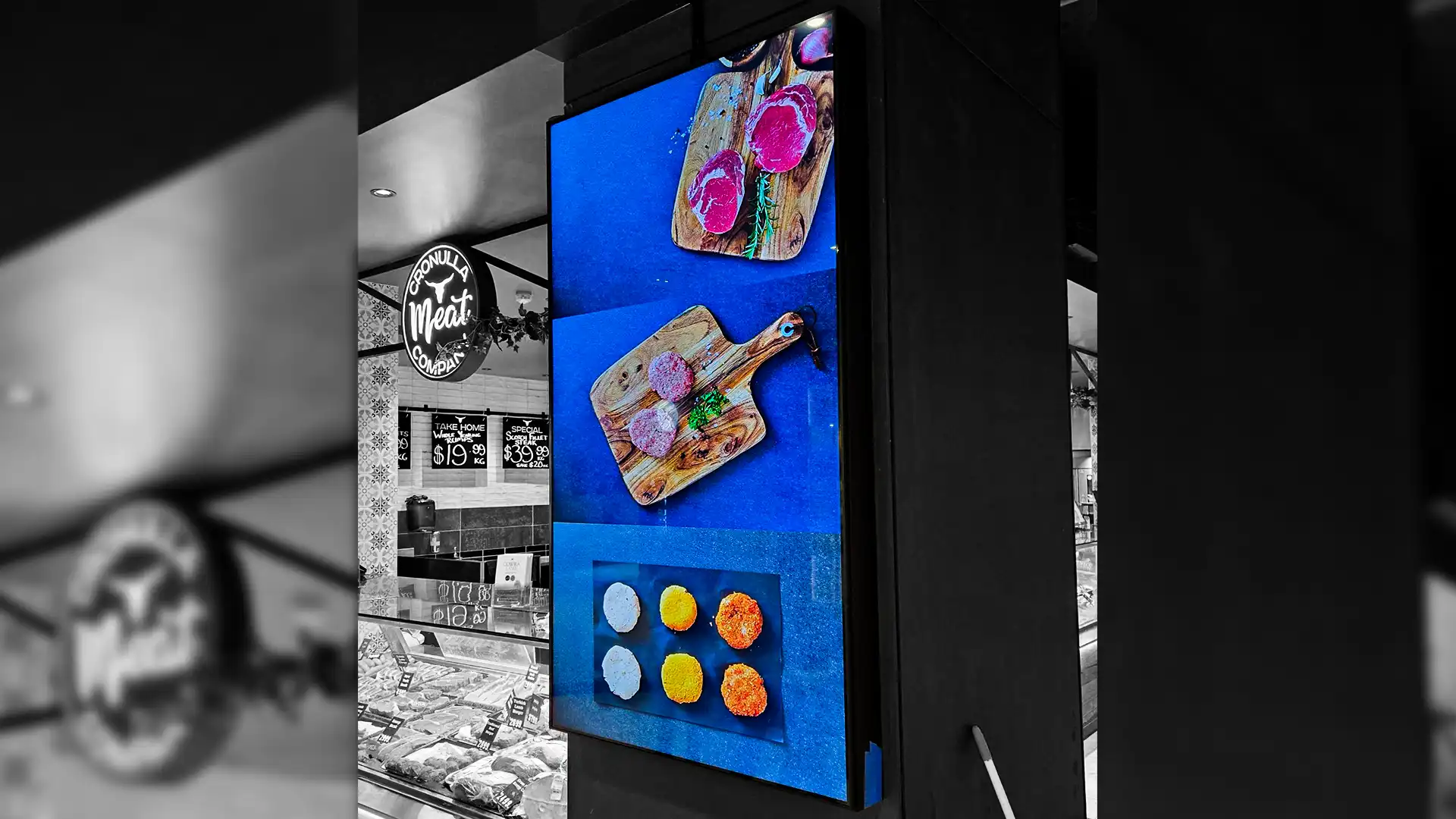 Indoor LED video wall mounted in corporate lobby displaying branded content